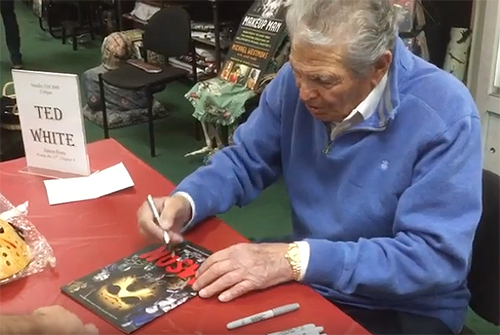 Ted White signs a copy of the Jason franchise guide