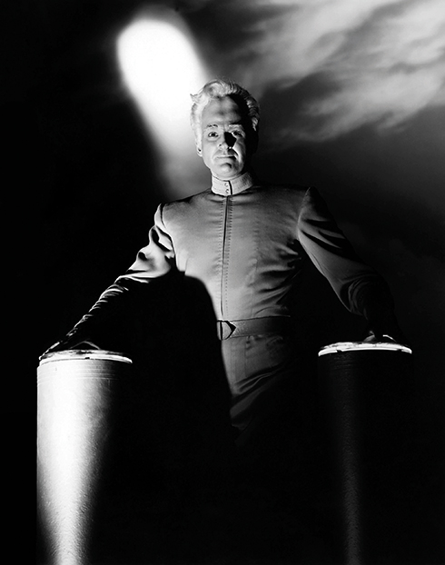 Jeff Morrow as the alien Exeter pictured with Metalunan technology in This Island Earth.