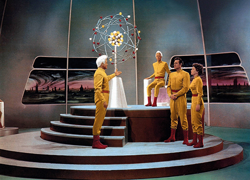 Jeff Morrow, Douglas Spencer, Rex Reason and Faith Domergue stand in a futuristic environment in This Island Earth 1955